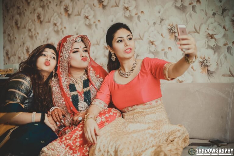 Wedding guests taking a playful selfie together during the celebration