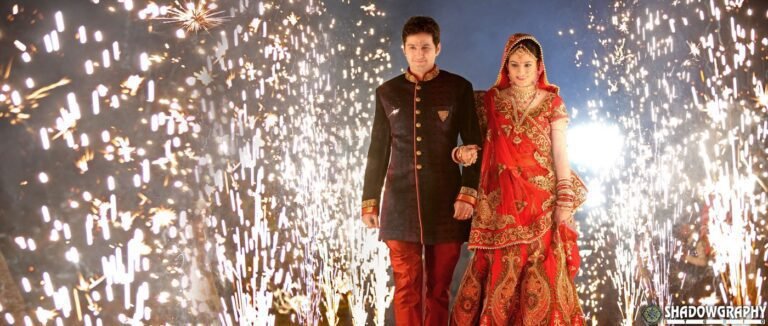 Bride and groom entering their wedding reception through a tunnel of cold pyro sparks