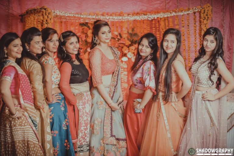 A line of bridesmaids posing together during the wedding celebrations