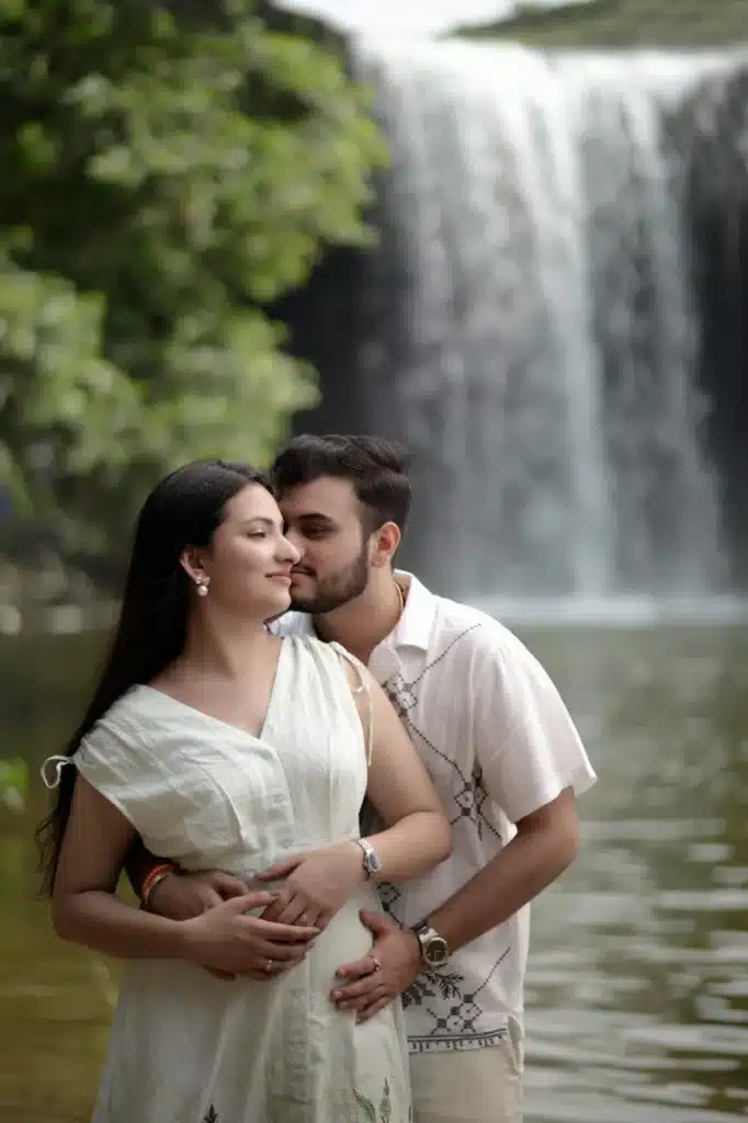 Close portrait of a couple beside the waterfall at Ganga Mahadev
