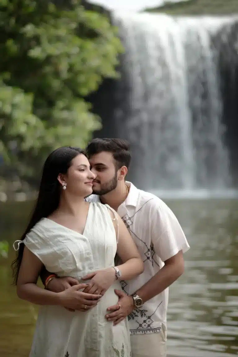 Close portrait of a couple beside the waterfall at Ganga Mahadev