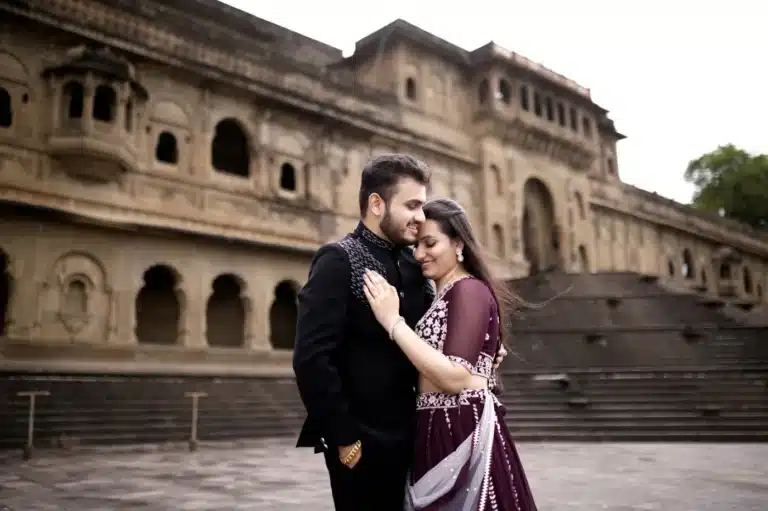 Couple beside palace steps at Maheshwar