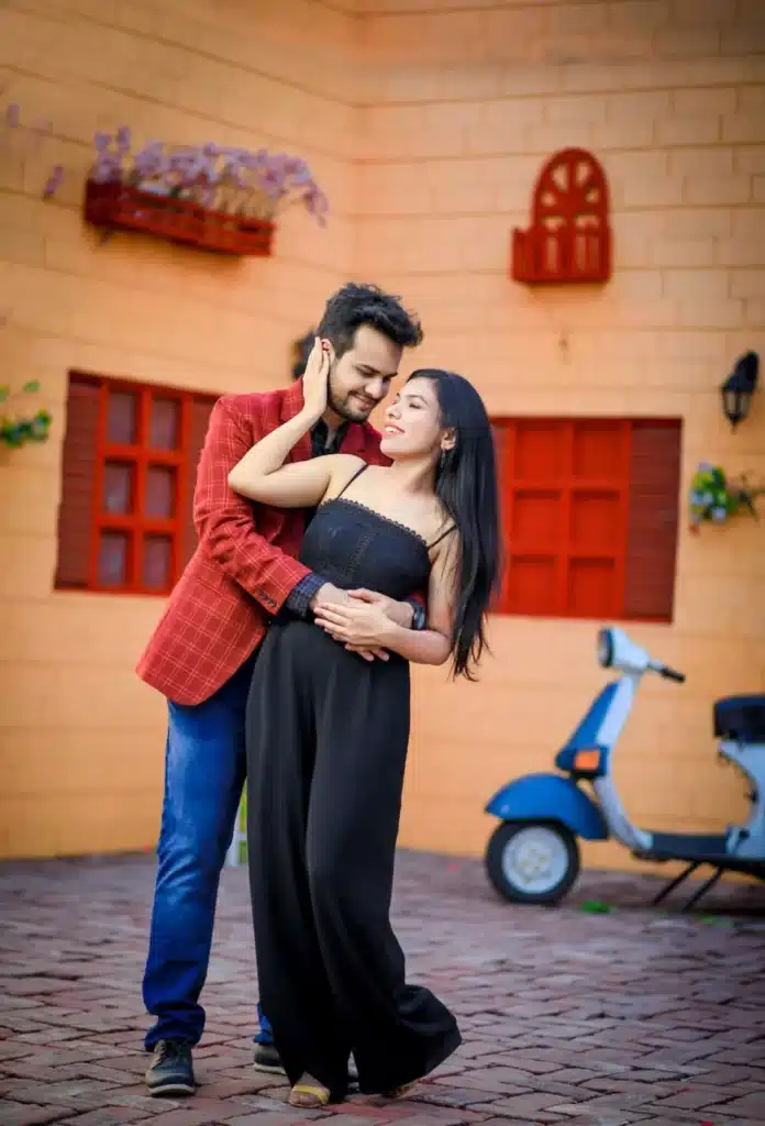 Couple posing in a street-style Film City set