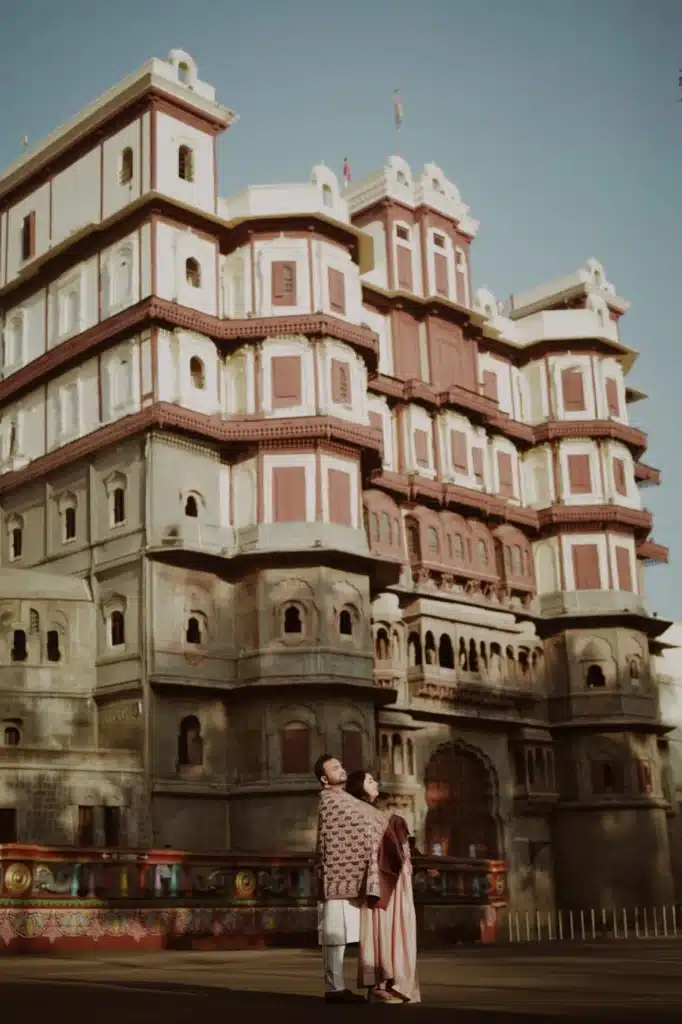 Couple in front of the palace facade at Rajwada
