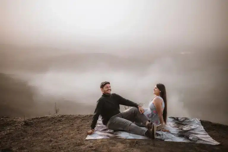 Couple seated on a misty hilltop at Jaam Gate area