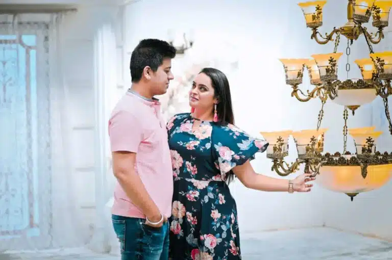 Couple beside chandeliers at a Film City setup